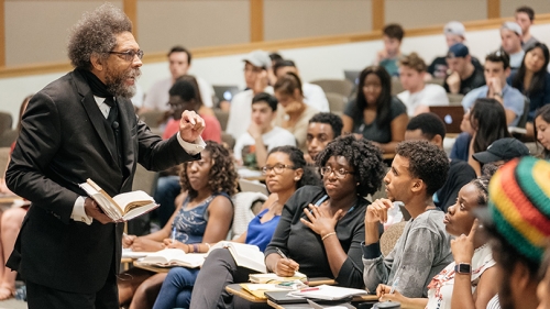 Cornel West delivering a lecture to students in a classroom