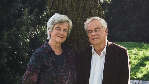 A portrait from the waist up of Christine Mann (left) and Frido Mann (right)